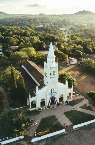 View of the church in the Paraguayan city of Aregua with greenery in the background